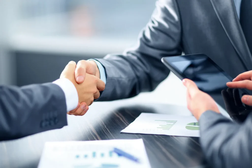Advisor And Client Shaking Hands