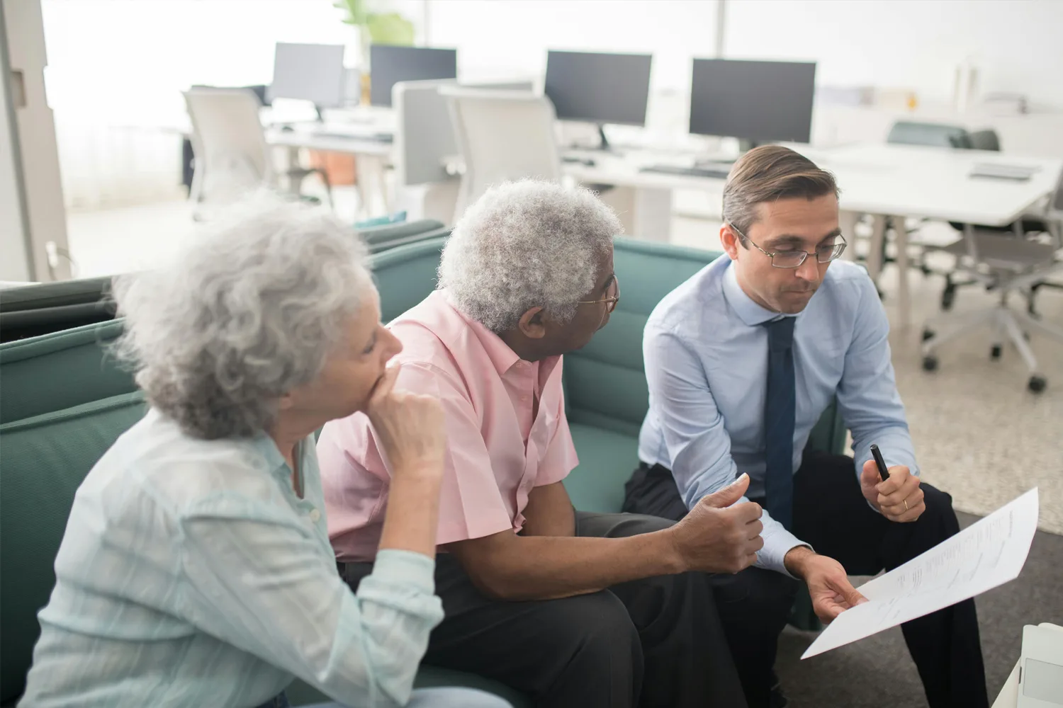 Advisor Helping Couple Plan For Retirement